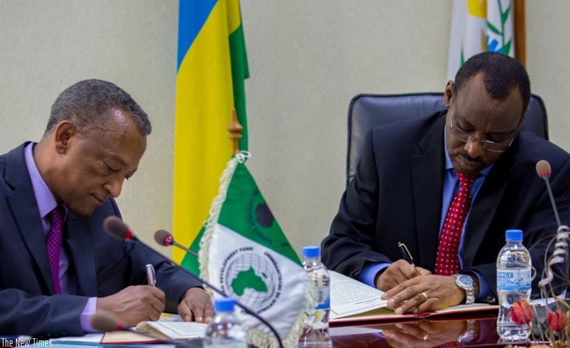 Negatu Makonnen and Minister Gatete sign the loan agreement yesterday.  Ruzizi III is shared by Rwanda, Burundi, and the Democratic Republic of Congo (DRC) and is expected to generate more than 147MW of electricity. (T. Kisambira)
