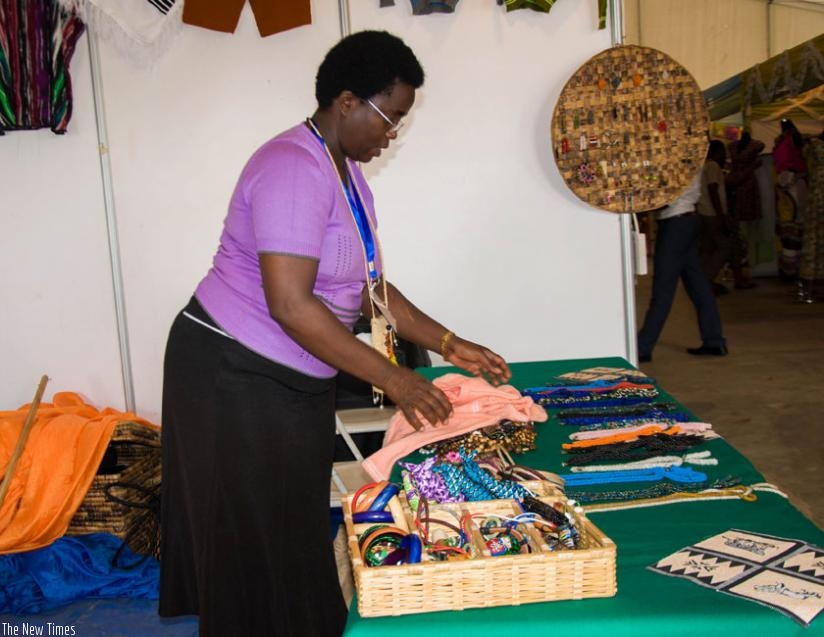 A woman entrepreneur displays her products during the u2018Made In Rwandau2019 expo recently. (Teddy Kamanzi)