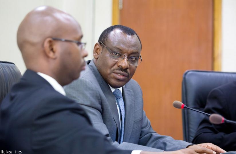 Finance and Economic Planning minister Claver Gatete (R) consults with Yusuf Murangwa, director-general of National Institute of Statistics of Rwanda, during a media briefing in Kigali yesterday. (Timothy Kisambira)