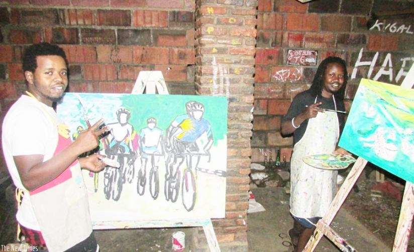 Jay Polly (left) and Hakizimana work on their respective pieces. (Joseph Oindo)