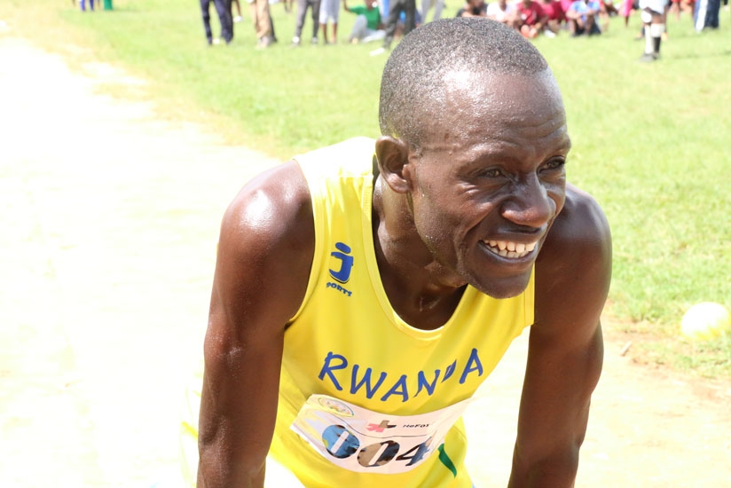 Robert Kajuga looking exhausted after winning Nyanza Peace Marathon recently. (Geoffrey Asiimwe)