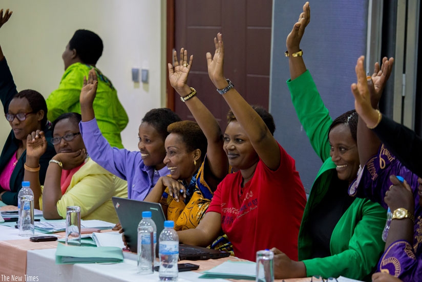 Members of the Forum for Women Parliamentarians in Rwanda vote their new president by show of hands during a meeting in Bugesera District yesterday. (Timothy Kisambira)