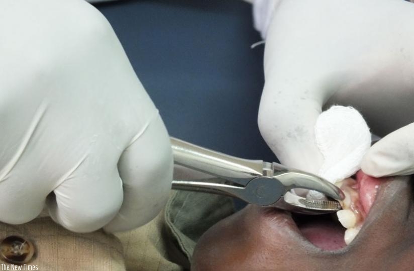 A bad tooth being extracted. Good oral hygiene prevents such incidences. (Solomon Asaba)