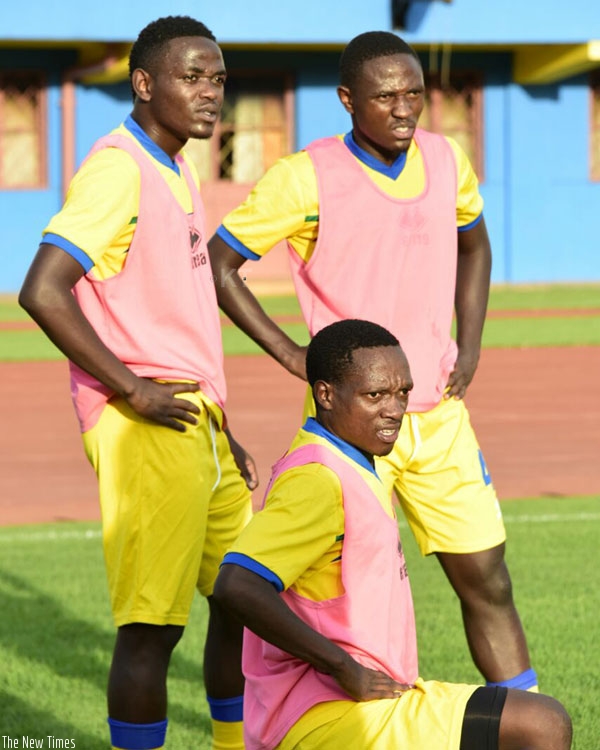 Amavubi players (L-R) Muhadjili Hakizimana, Djihad Bizimana and Celestin Ndayishimiye during training at Amahoro stadium yesterday. (Courtesy)