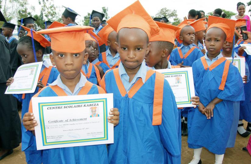 Centre Scolaire Kabeza pupils display certificates after a graduation event. Many parents are blamed for not dedicating enough time to the upbringing of their children. (File)