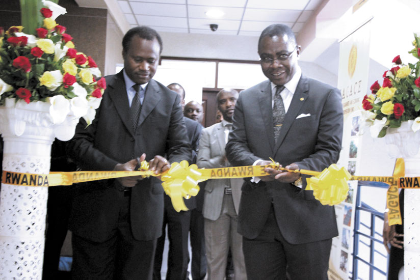 Ndagijimana (left) and Dondra, the FAGACE chief, launching the branch at RSSB Towers in Kigali on Wednesday. (Anitah Kirezi)