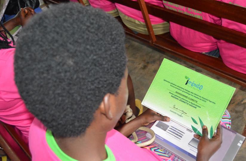 One of the newly awarded BPGs admiring her certificate. (Courtesy)