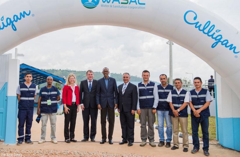 President Kagame together with Erica Barks-Ruggles, the U.S. Ambassador to Rwanda, (third left) and Culligan International staff led by the head Laurence Bower (fourth left), at the launch of Nzove 2 water treatment plant yesterday. (Village Urugwiro)