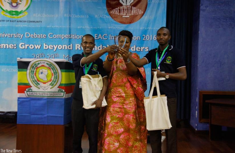 University of Rwanda u2013 College of Agriculture & Veterinary Medicine (UR-CAVM) students receive their trophy from EALA Member Nyirahabineza at the closing ceremony. (Courtesy)