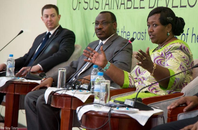Minister Binagwaho (R) explains the need to finance the health sector as Minister Gatete (C) and Jesse Joseph of USAID look on during the meeting in Bugesera. (Doreen Umutesi)