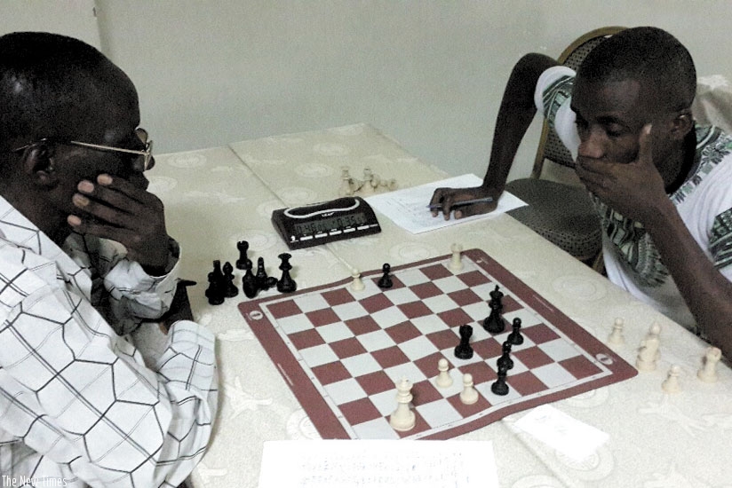 Jean-Baptiste Hakizimana (L) playing white in round nine of the pre-qualifiers, succumbed to Valentin Rukimbira's tactical genius. (James Karuhanga)