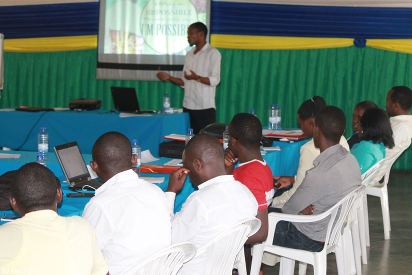 An instructor takes the librarians through a panel discussion. (Moses Opobo)