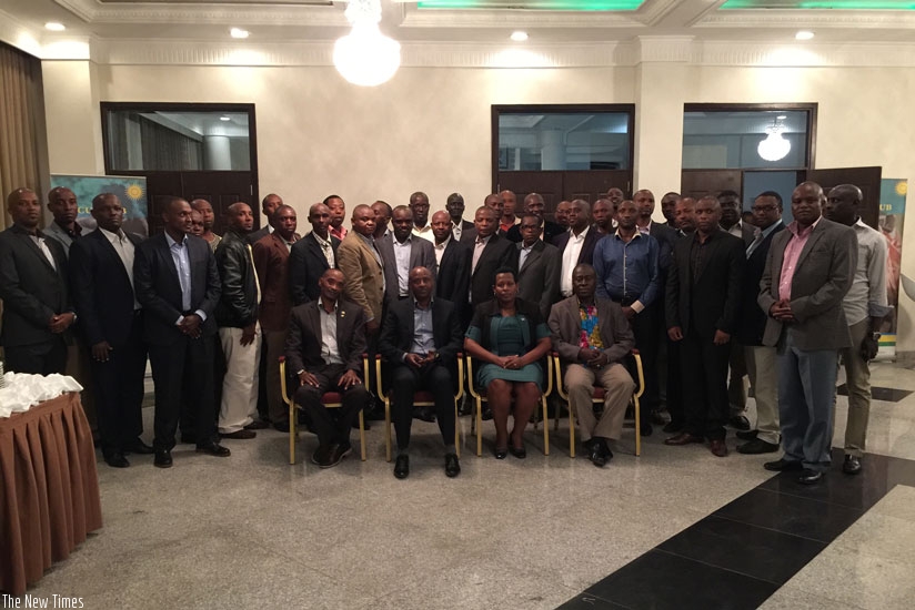 Major Gen Jean-Bosco Kazura seated with Ambassador Tumukunde and the RDFCSC delegation standing behind them. (Courtesy)