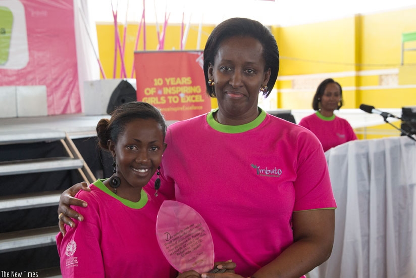 First Lady Jeannette Kagame poses with a Best Performing Girl on the 10th anniversary of the Campaign held in Kigali on 5 July 2015. 36 Best Performing Girls (BPGs) will today be r....