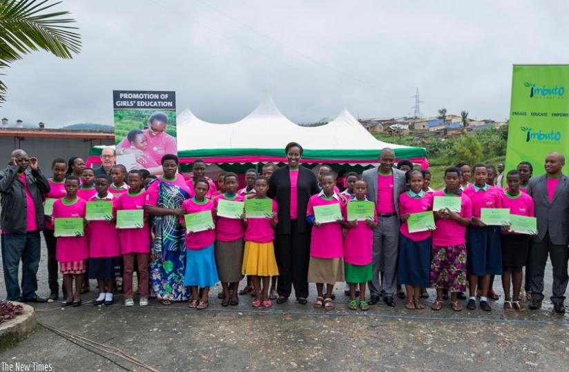 First Lady Jeannette Kagame and guests pose with the best performing girls. (Courtesy)