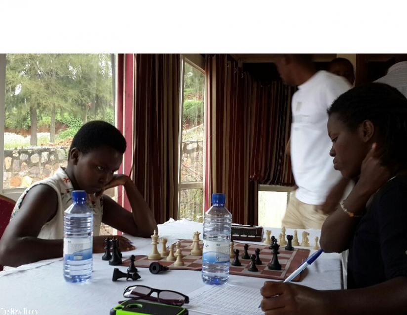 Joselyne Uwase (L), 13, surprised everyone, including herself when she tricked and overpowered an unsuspecting female national chess champion, Marie Faustine Shimwa. (James Karuhanga)