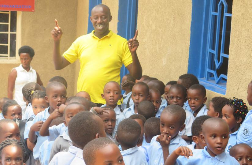 Albert Musabyimana plays with the kids. (Lydia Atieno)