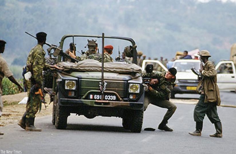 French soldiers hand over an unwilling Genocide victim to militiamen at a road block during the 1994 Genocide against the Tutsi. (File)