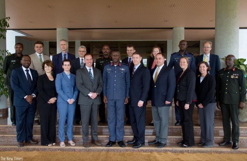 Brig Gen Karamba (5th L) in a group photo with the visiting delegation from the US National Defence College. (Timothy Kisambira)
