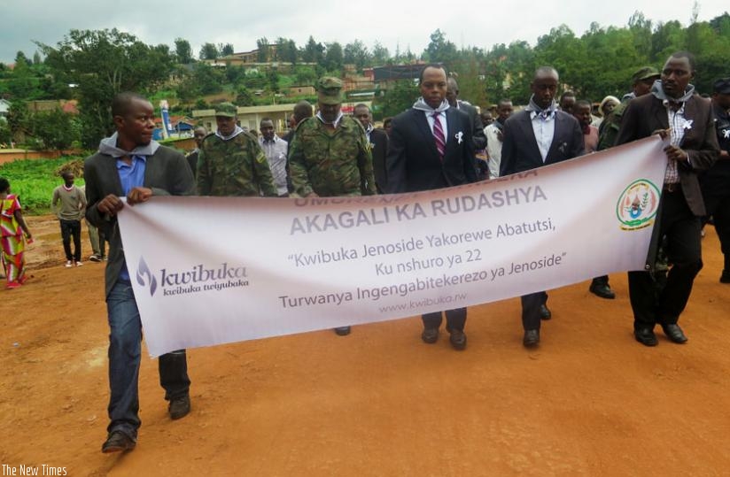 RDB CEO Francis Gatare (3rd L), Gasabo district mayor Stephen Lwamurangwa (2nd R) and other Rwandans during the march to start the Genocide  commemoration activities in Gasabo yest....