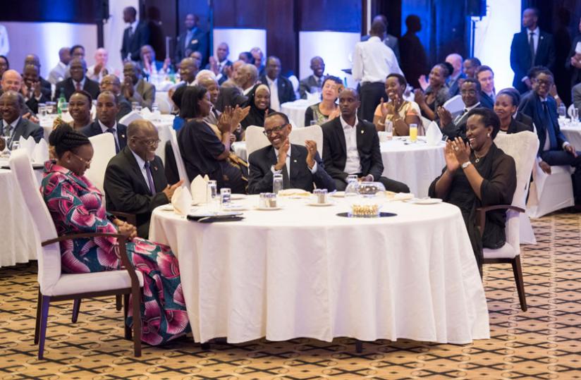 President Paul Kagame and First Lady Jeannette Kagame share a light moment with their Tanzanian counterparts, Dr John Pombe Magufuli and Janeth Magufuli, at the state dinner in Kig....
