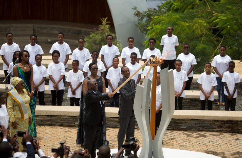 President Kagame and President Magufuli of Tanzania light the flame of Remembrance at the Kigali Genocide Memorial. Looking on are First Lady Jeannette Kagame, Tanzania's First Lad....