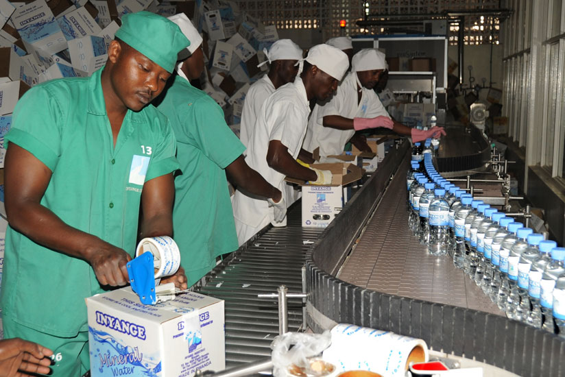 Workers at Inyange Industries pack water. (File)