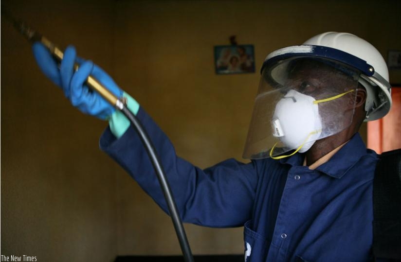 A man carries out indoor residual spraying in Bugeseera District recently. (Francis Byaruhanga)