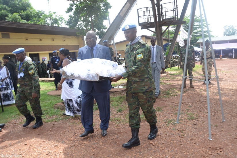 CAR defence minister Joseph Bindoume and RDF contingent commander Lt. Col. Claver Kirenga lay a wreath in honour of the Genocide victims. (Courtesy)