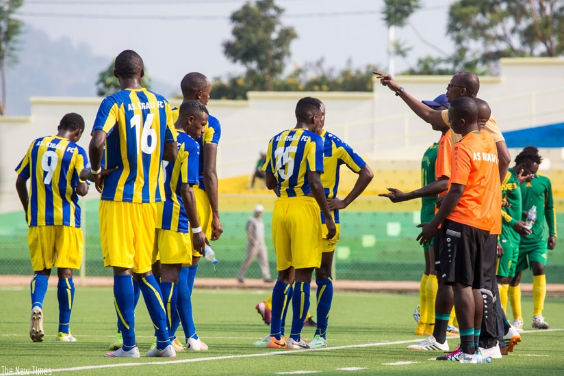 AS Kigali coach Nshimiyimana (R) stresses a point to his players during the match against Marines on Feb. 15, 2016. (Timothy Kisambira)