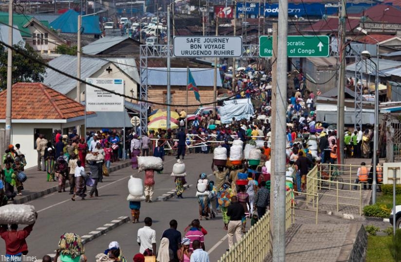 Women and other traders crossing on the Rwanda-DR Congo at Goma border post during a market day. Women still face many barriers while trading between countries. (File)