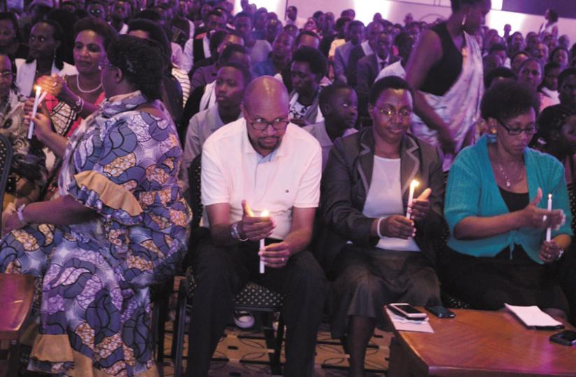Mourners gather for a candlelighting evening in memory of Genocide victims at Kigali Serena Hotel.