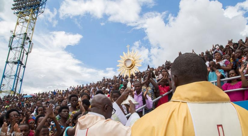 Father Rugirangoga prays for christians who turned up for the 'healing mass' at Amahoro stadium, on Sunday. (File)