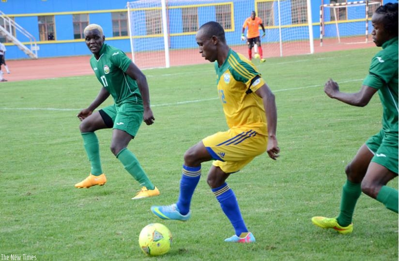 Midfielder Jean Claude Iranzi (C) battles with Kenyan defenders in last year's edition. (S. Ngendahimana)