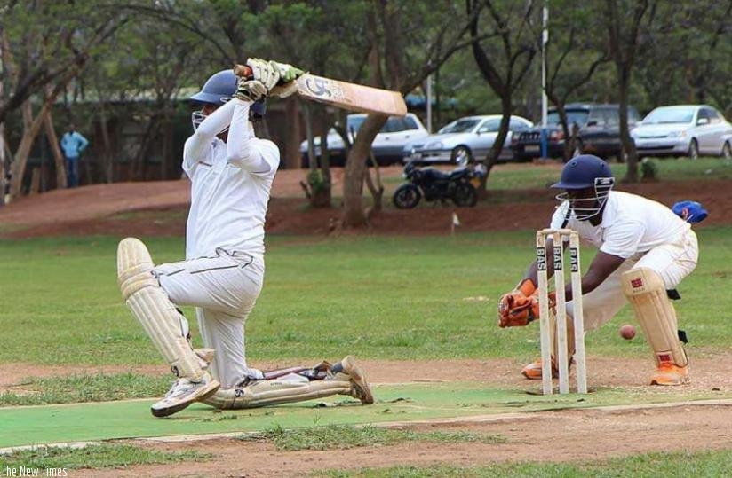 Eric Dusingizimana (L) in action against Indorwa in 50-vers premier league at Kicukiro cricket ground recently. (Courtesy)