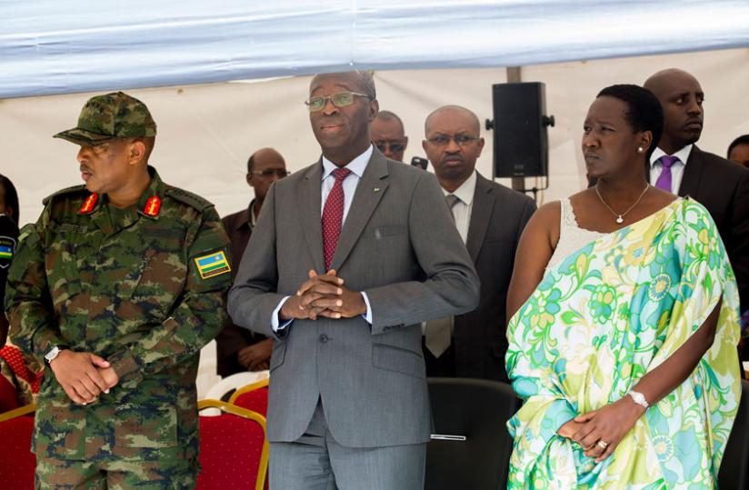 L-R; Chief of Defence Staff Gen Patrick Nyamvumba, Prime Minister Anastase Murekezi and Julienne Uwacu, the minister for sports and culture, at Rebero Memorial site while marking t....
