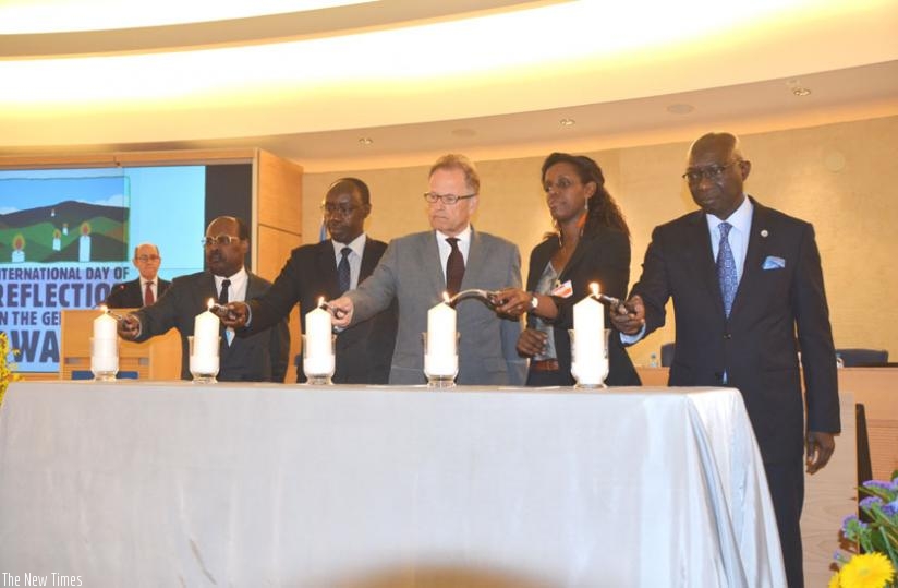 (L-R): Dr Gakuba, Amb. Ngarambe, Moller, Lyamukuru, Dieng light candles during the commemoration event in Geneva on Monday. (Courtesy)