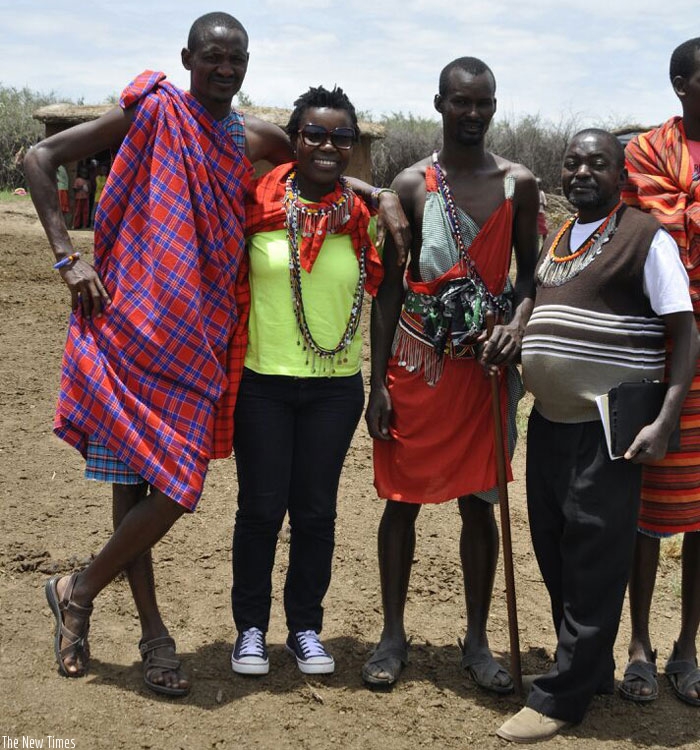 The writer (second left) with Masai herdsmen and a KTB official during the trip. (Courtesy)