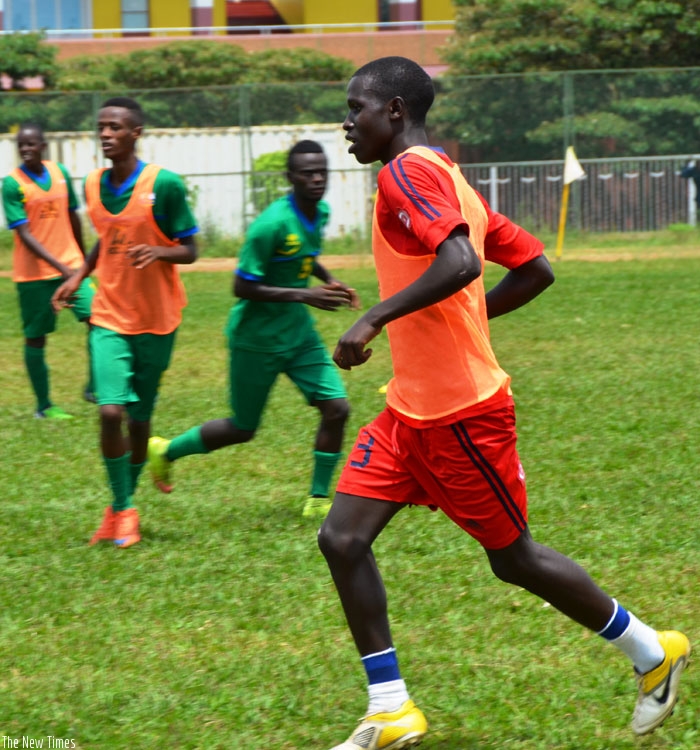Uganda-based striker Iradukunda trains with his Rwanda U-20 teammates on Monday at Amahoro stadium training field. (S. Ngendahimana)