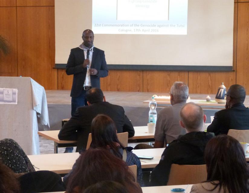 Philbert Gakuba a genocide survivor and one of the organizers of the event in Cologne addresses the audience. (Courtesy)