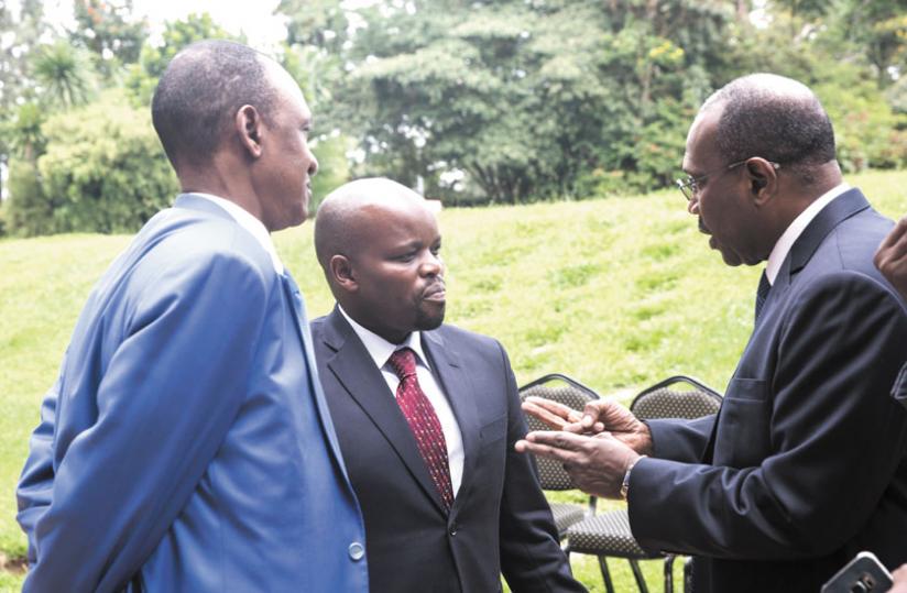 Toure (R) chats with Nsengimana (C) and Mali's ICT minister on Monday. (File)