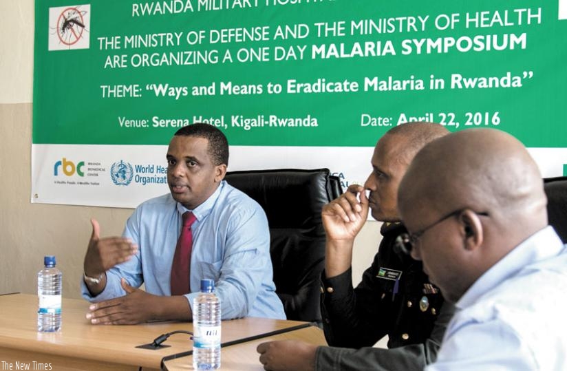 Dr Ntaganda (L) addresses the media on preparations for the malaria symposium as other officials look on. (Doreen Umutesi)