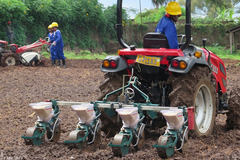 A trainee in agriculture mechanisation plants maize seeds using a maize planting machine at IPRC South in Huye District last year. (Emmanuel Ntirenganya)