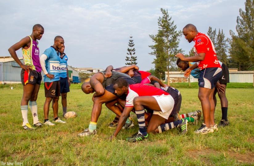 Jean Baptiste Itanzi (standing right) conducts a scrum session at Utexrwa during a past training session. (S. Kalimba)