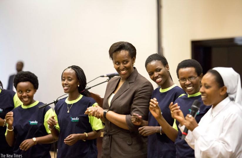 First Lady Jeannette Kagame joins mentees for a song and dance led by Soeur Immaculee Uwamaliya, of Rwamagana School of Nursing and Midwifery (R). (Courtesy)
