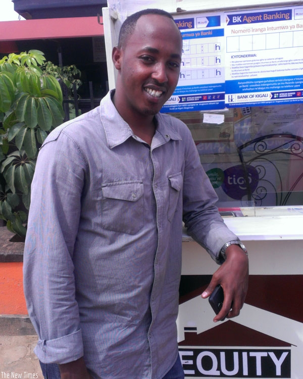 Mugisha at his bureau in Remera. The student entrepreneur says engaging in business while studying opens many opportunities for students. (Anitha Kirezi)