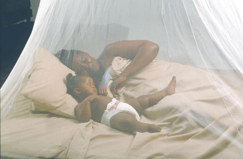 A mother with her baby under a mosquito net. (File)