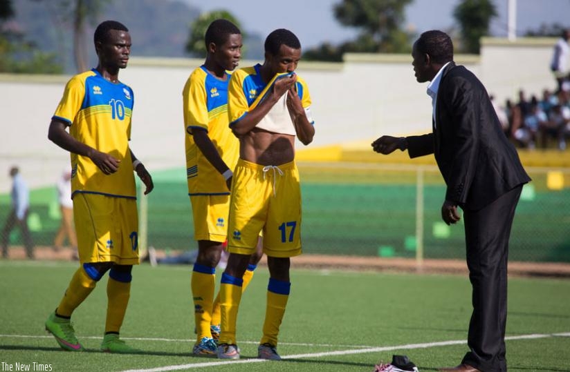 Rwanda U20 national team head coach Kayiranga giving instructions to his player during the first leg against Uganda. (T. Kisambira)