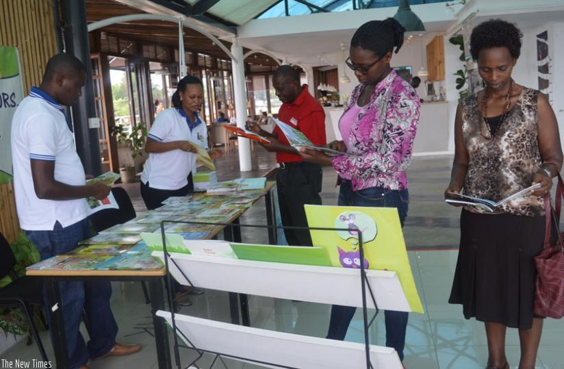 Publishers and buyers interact at the Kinyarwanda childrenu2019s books exhibition on Friday. (Samantha Teta)