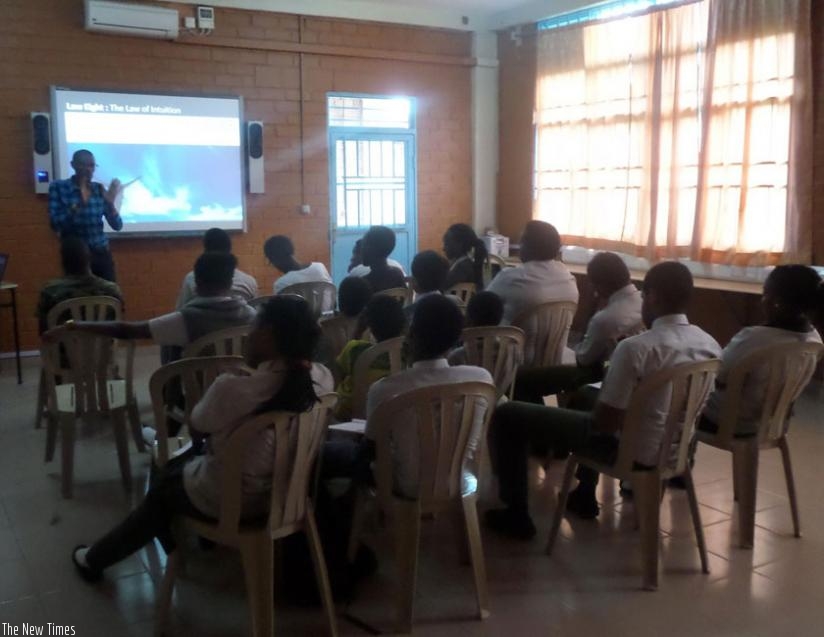 Tumwine training students. The 21-year-old has conducted trainings in six high schools and one university. (Courtesy)